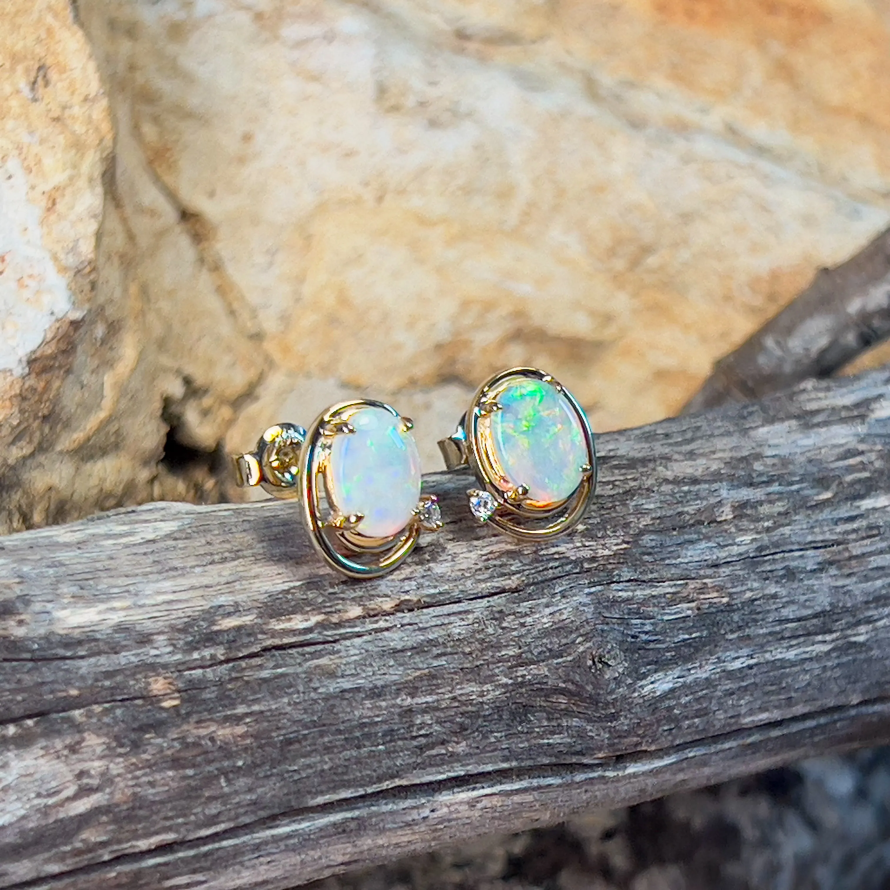 14kt Yellow Gold Oval Crystal Opal 1.48ct studs with diamonds