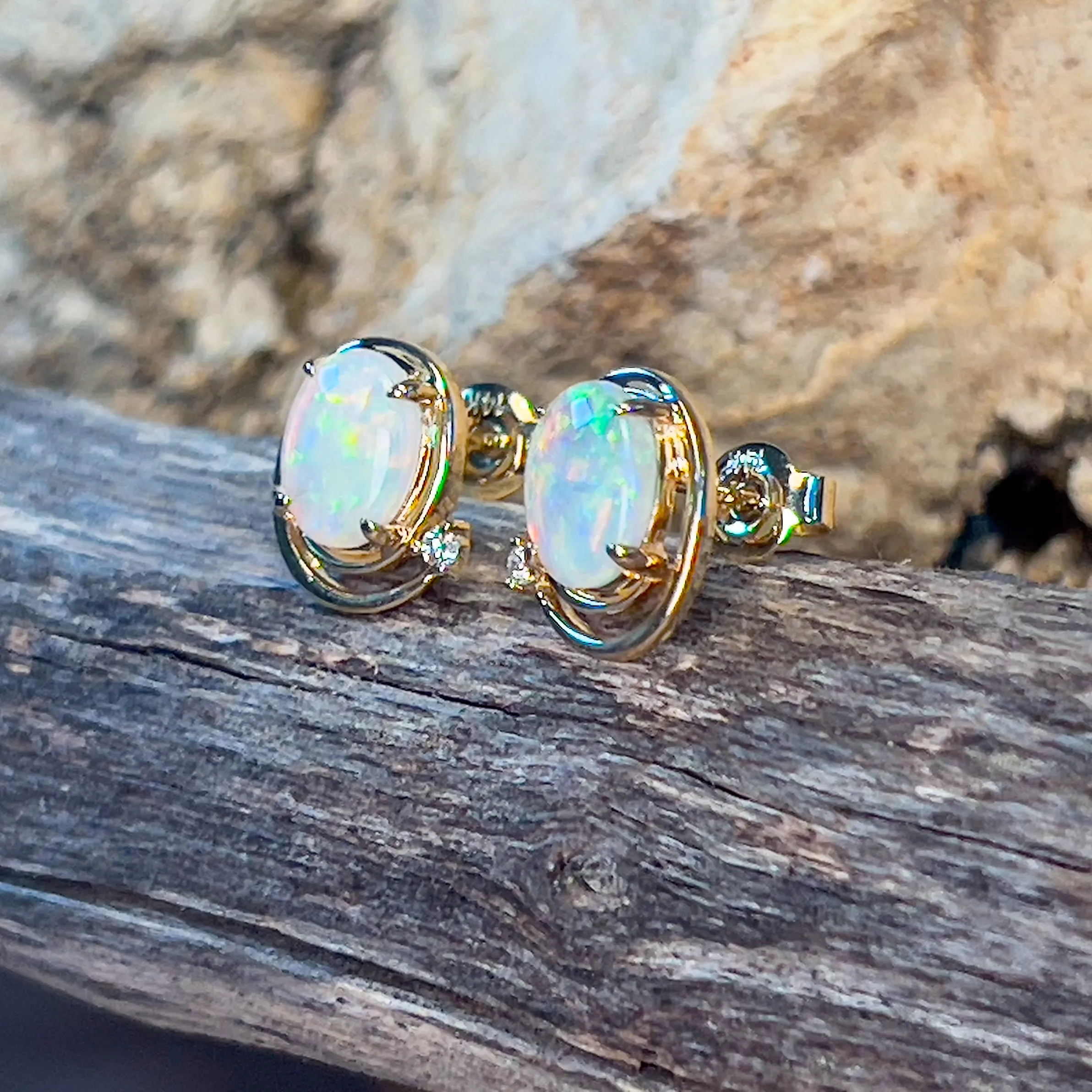 14kt Yellow Gold Oval Crystal Opal 1.48ct studs with diamonds