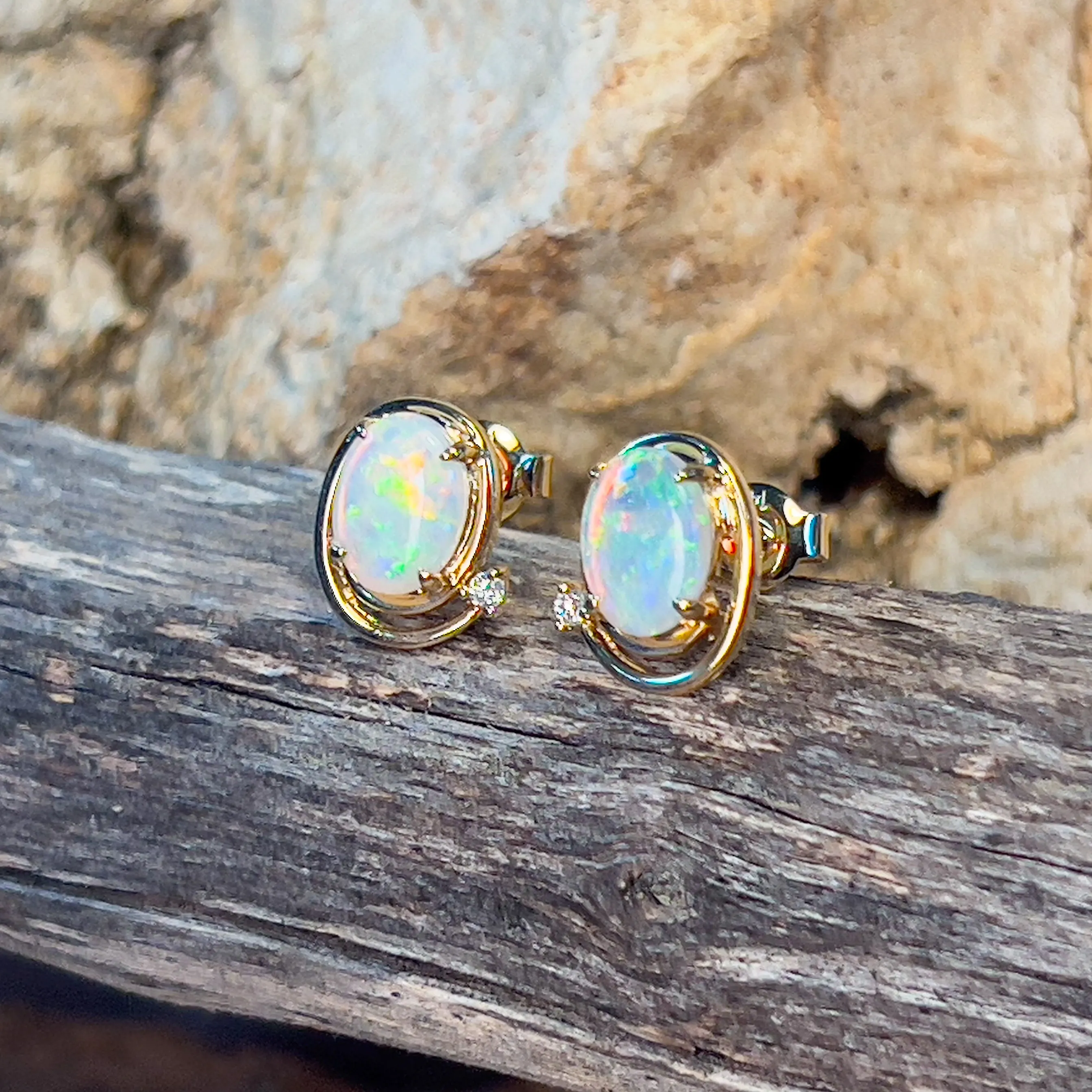 14kt Yellow Gold Oval Crystal Opal 1.48ct studs with diamonds