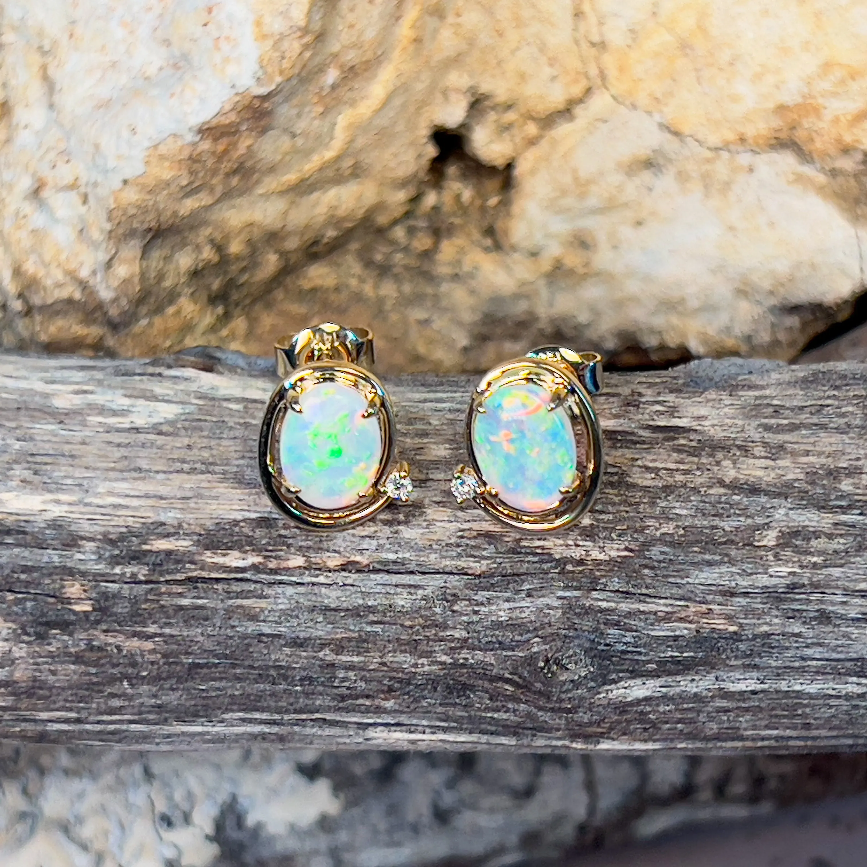 14kt Yellow Gold Oval Crystal Opal 1.48ct studs with diamonds