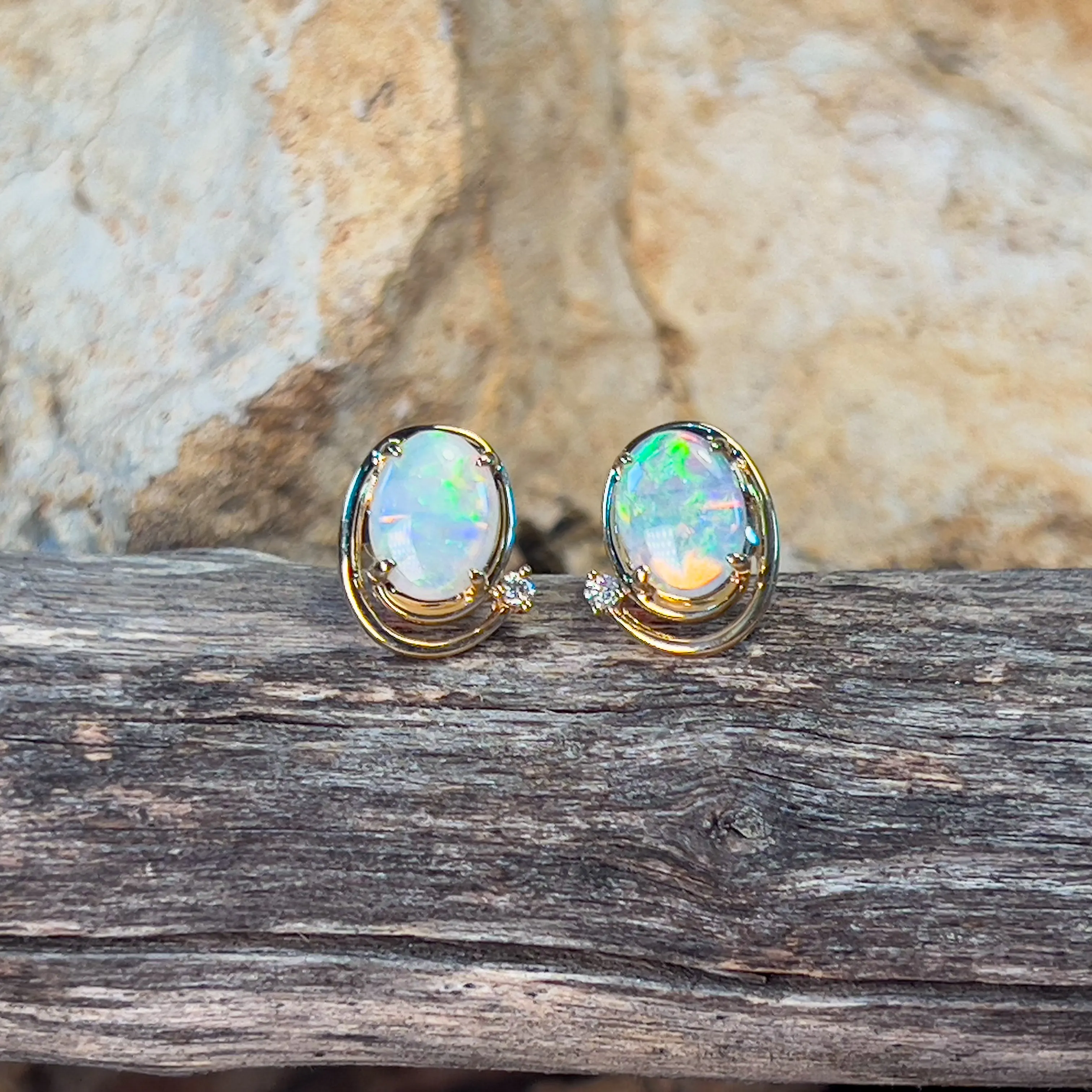 14kt Yellow Gold Oval Crystal Opal 1.48ct studs with diamonds