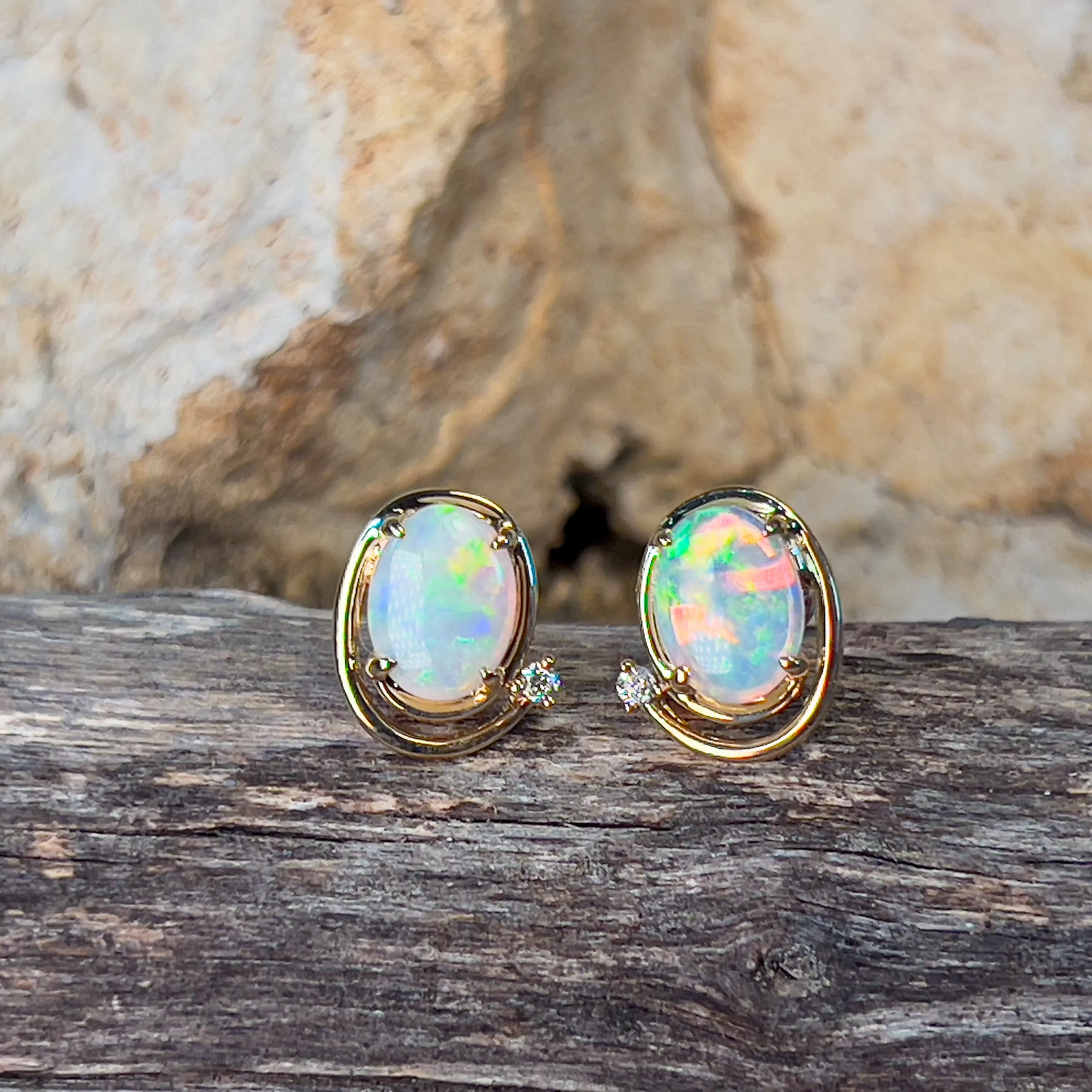 14kt Yellow Gold Oval Crystal Opal 1.48ct studs with diamonds