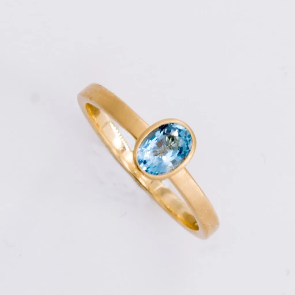 18k Matte Yellow Gold Yumdrop Ring with a Oval Aquamarine by Kimberly Collins Colored Gems Regard
