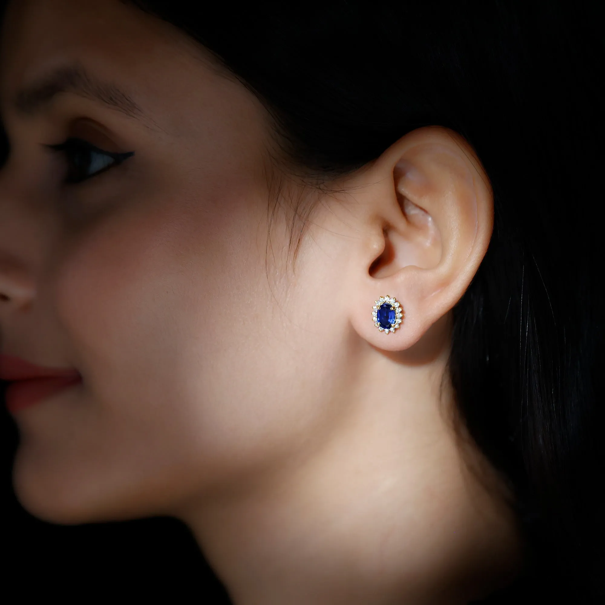 Oval Cut Created Blue Sapphire Stud Earrings with Moissanite Halo