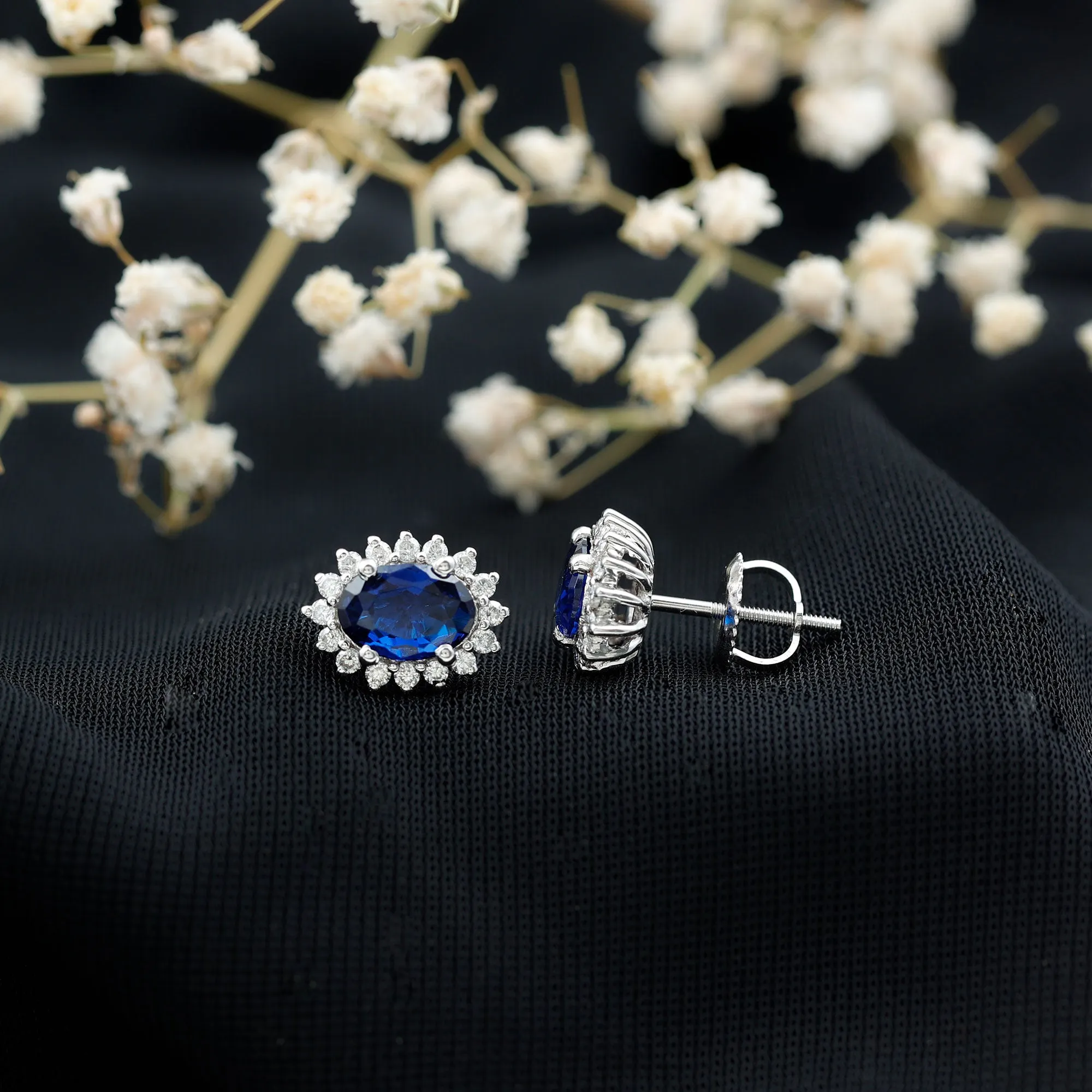 Oval Cut Created Blue Sapphire Stud Earrings with Moissanite Halo
