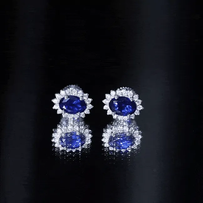 Oval Cut Created Blue Sapphire Stud Earrings with Moissanite Halo