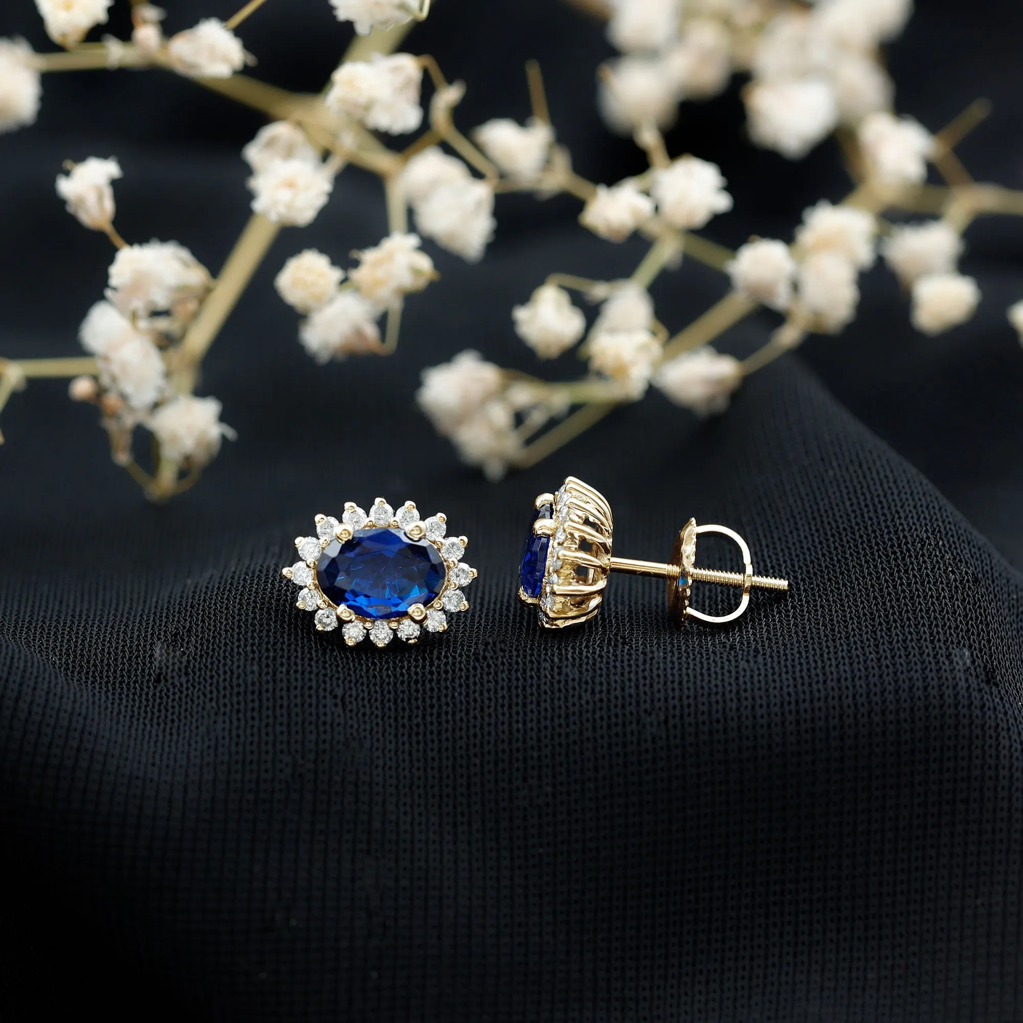 Oval Cut Created Blue Sapphire Stud Earrings with Moissanite Halo