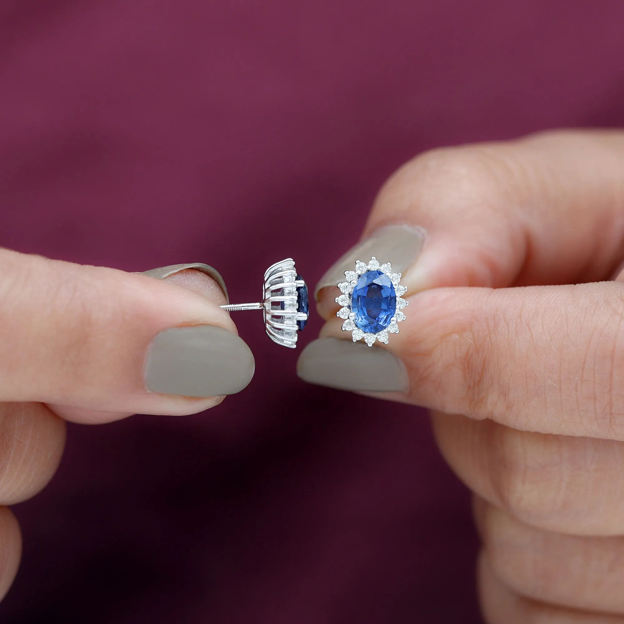 Oval Cut Created Blue Sapphire Stud Earrings with Moissanite Halo