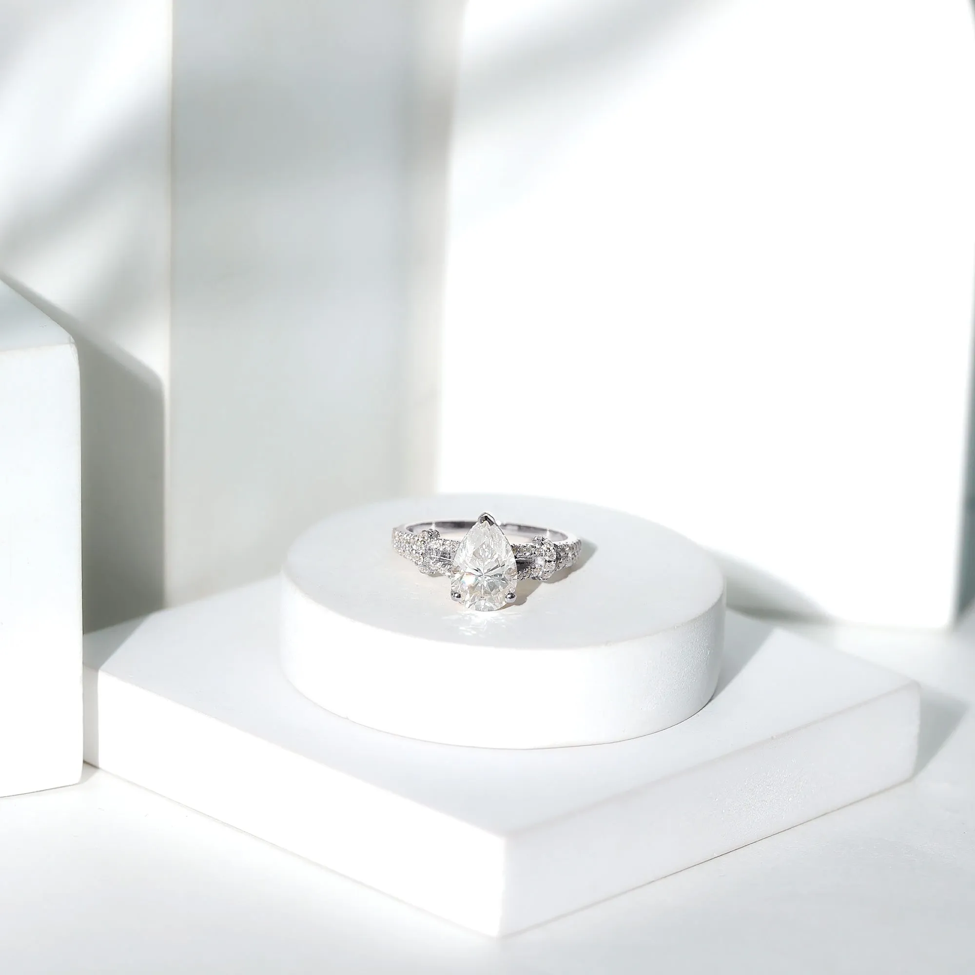 Pear Shaped Moissanite Solitaire Engagement Ring in Split Shank