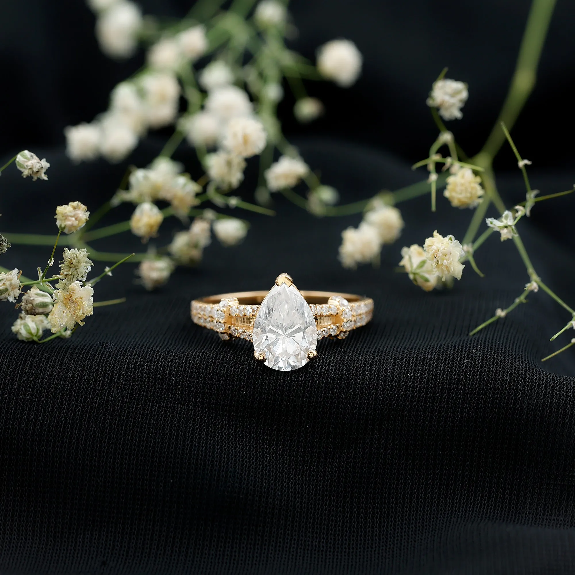 Pear Shaped Moissanite Solitaire Engagement Ring in Split Shank