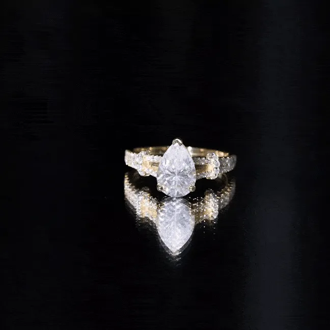 Pear Shaped Moissanite Solitaire Engagement Ring in Split Shank