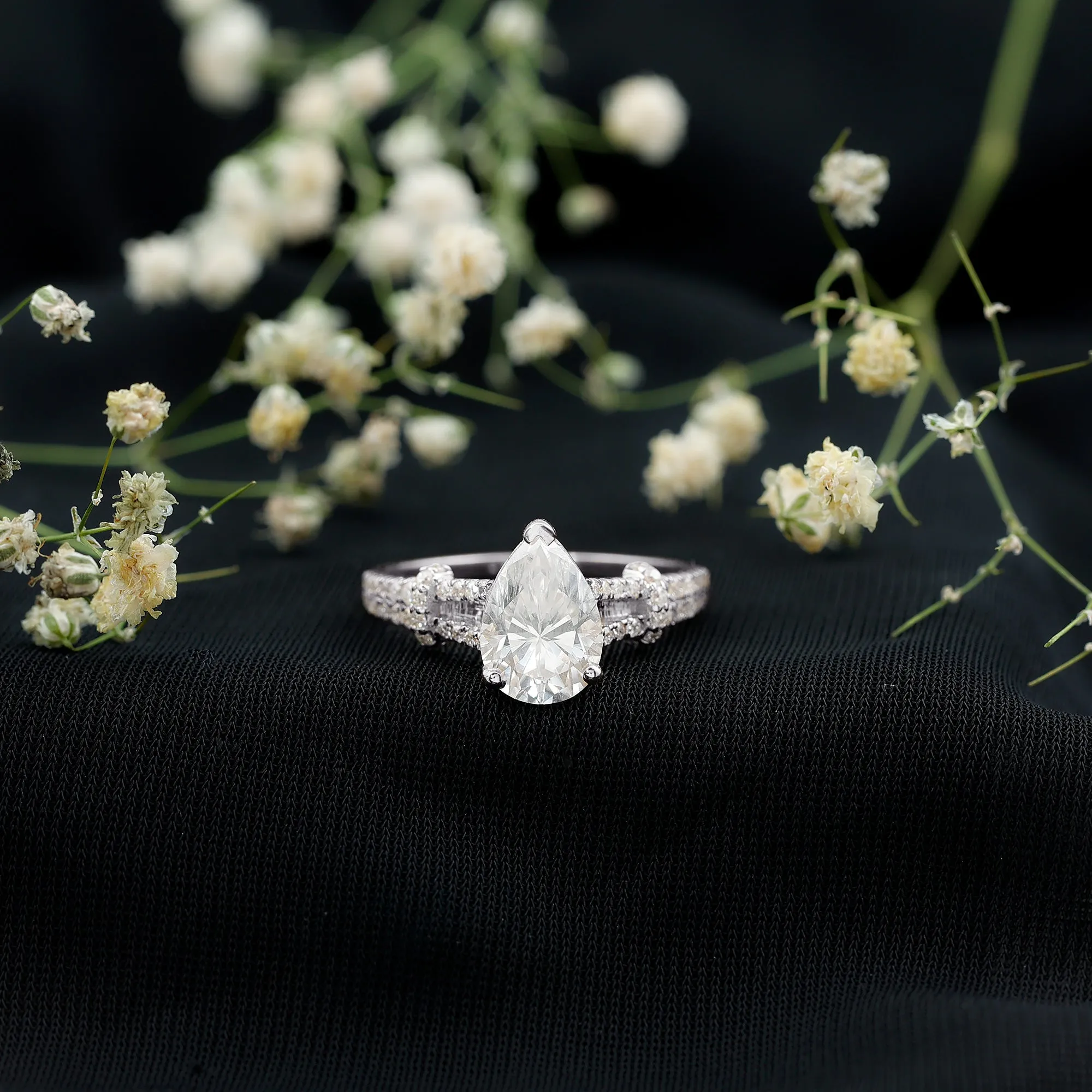 Pear Shaped Moissanite Solitaire Engagement Ring in Split Shank