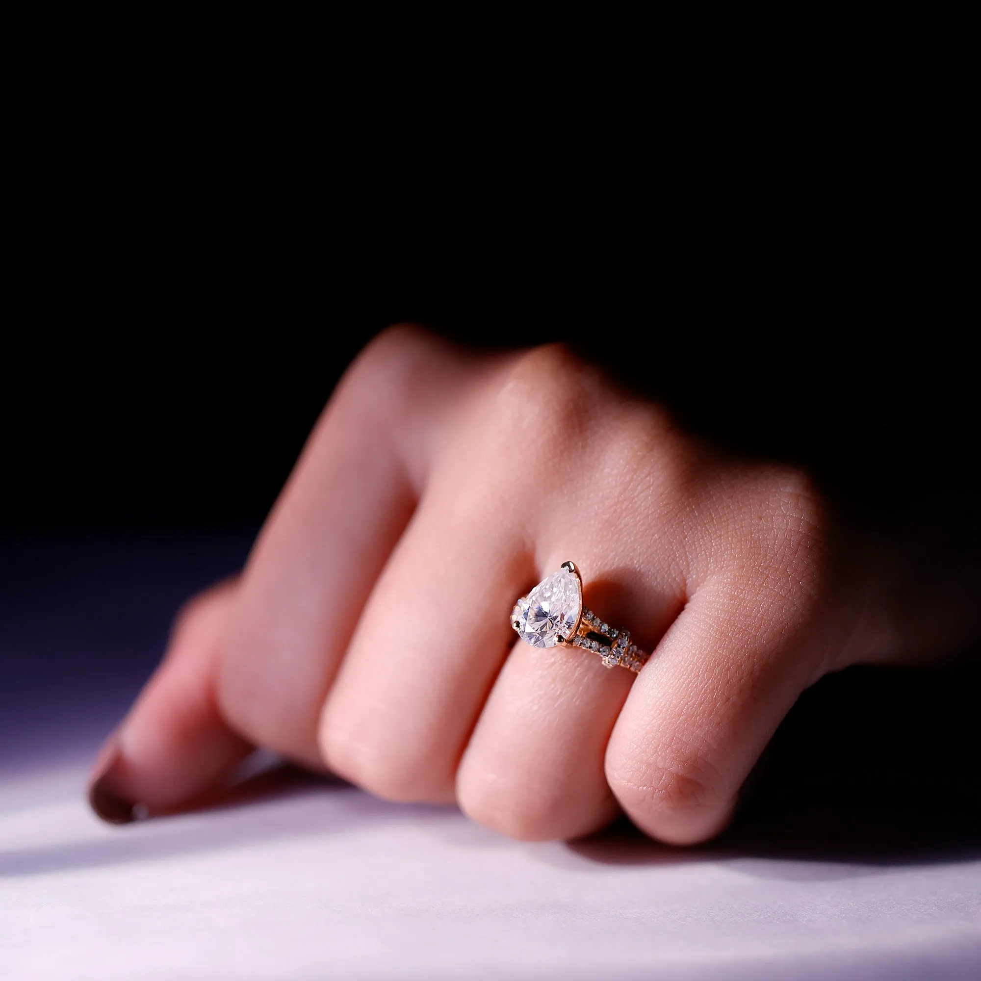 Pear Shaped Moissanite Solitaire Engagement Ring in Split Shank