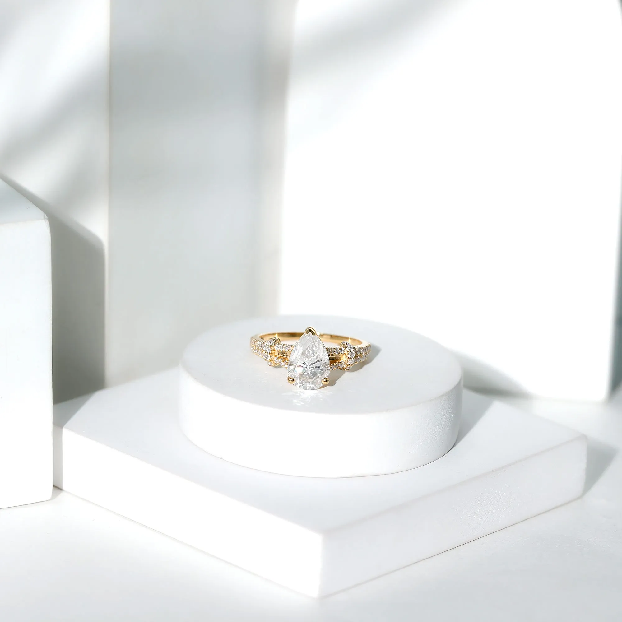 Pear Shaped Moissanite Solitaire Engagement Ring in Split Shank